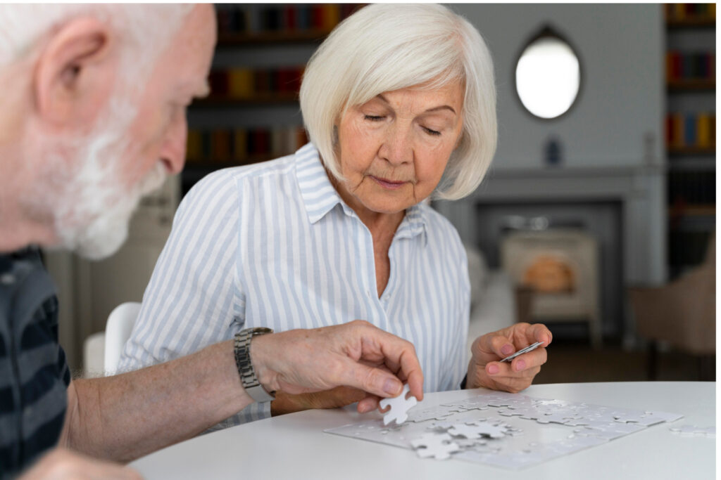 Woman playing cards in a senior living community